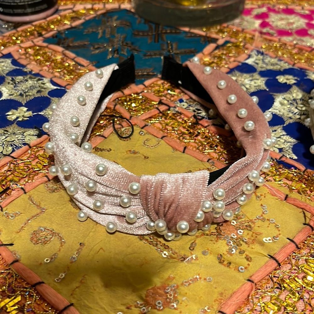 Hair assessories one is crème with pearls the other is pink pearls